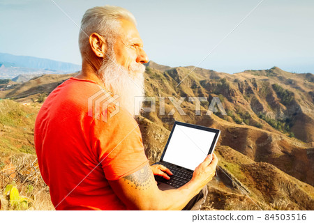 Senior man with laptop Senior man with laptop 84503516