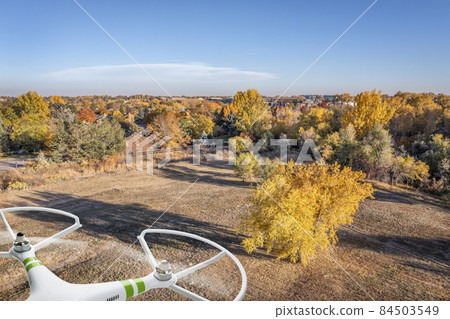 drone flying over urban landscape 84503549