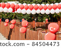 Red balloons with the emblem of the flag of Turkey decorate the street 84504473
