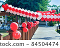Red balloons with the emblem of the flag of Turkey decorate the street 84504474