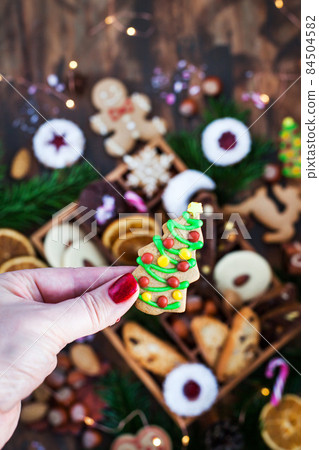Sweet Christmas cookies in wooden box on rustic table 84504582