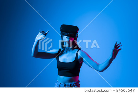 Woman developer using VR headset to designing a new products or technologies using VR technology. Woman developer using VR headset to designing a new products or technologies using VR technology. 84505547