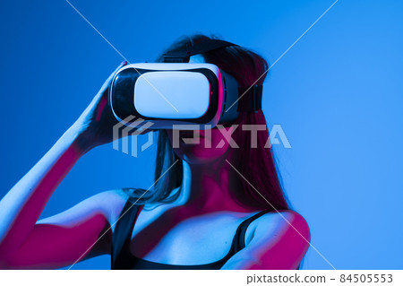 Woman with glasses of virtual reality. Future technology concept. 84505553