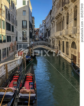 venetian canal and old brick houses in Venice, Italy venetian canal and old brick houses in Venice, Italy 84507949