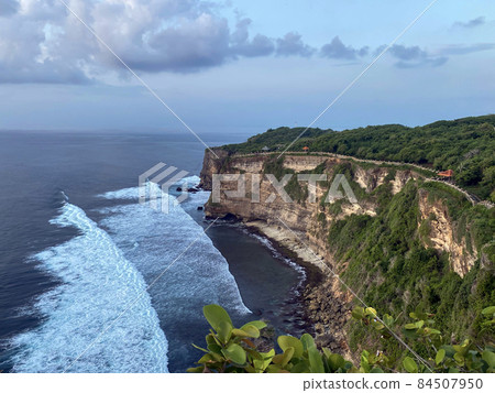 Sunset from the Pura Uluwatu temple on Bali island in Indonesia. - stock photo Sunset from the Pura Uluwatu temple on Bali island in Indonesia. - stock photo 84507950