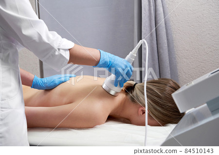 Hardware cosmetology. Young woman getting beauty treatment in spa salon Hardware cosmetology. Young woman getting beauty treatment in spa salon 84510143