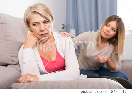 daughter comforts a sad mother daughter comforts a sad mother 84511471