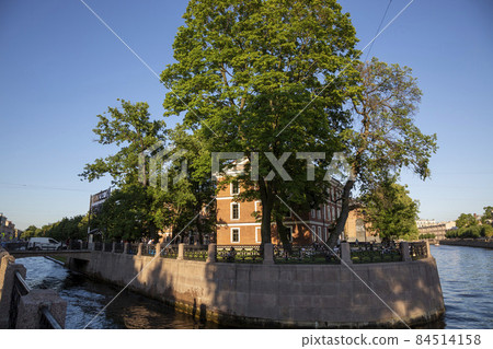 Saint Petersburg, Russia - July 13, 2021: Building on the Moyka River and the Admiralty Canal Embankment in St. Petersburg on the territory of the city park "New Holland" Saint Petersburg, Russia - July 13, 2021: Building on the Moyka River and the Admiralty Canal Embankment in St. Petersburg on the territory of the city park "New Holland" 84514158