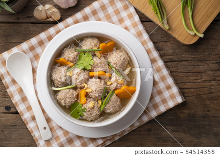 Clear glass noodle soup with Minced Pork and carrot.Asian Meatball Soup with cellophane noodle (Gaeng Jued Woon Sen) 84514358