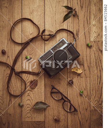 Autumn styling photo with retro camera and glasses 84515662