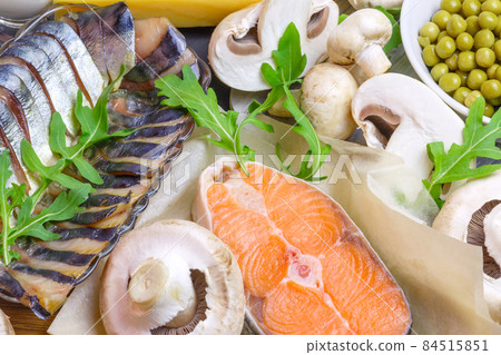 Healthy food, foods rich in vitamin D, omega 3 and protein, salmon fish, smoked mackerel, fresh champignons, green peas. Keto diet 84515851