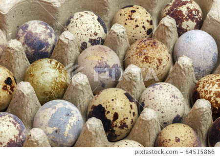 Food background of quail eggs close-up containing vitamin A, B, PP, B12, amino acids, beta-carotene, calcium, magnesium, iron, phosphorus, protein, choline, riboflavin, folic acid, selenium. Food background of quail eggs close-up containing vitamin A, B, PP, B12, amino acids, beta-carotene, calcium, magnesium, iron, phosphorus, protein, choline, riboflavin, folic acid, selenium. 84515866