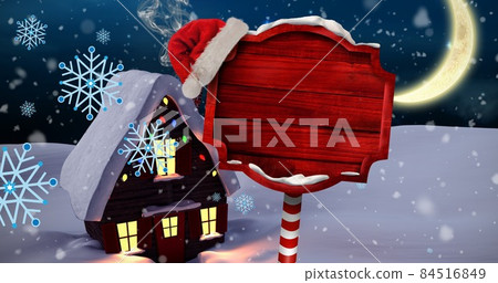 Copy space on red placard with snow covered house at christmas night 84516849
