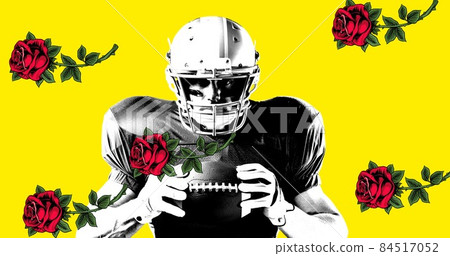 Portrait of confident male american footballer holding ball by roses against yellow background 84517052
