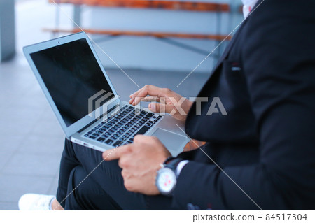 Cool guy arabic man uses laptop business center Cool guy arabic man uses laptop business center 84517304