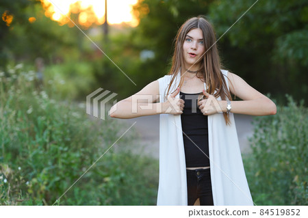 young girl on nature shows emotions 84519852