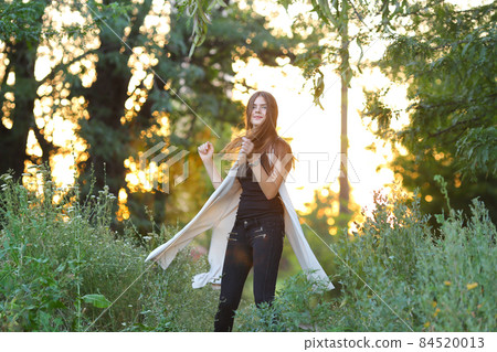 young girl on nature shows emotions 84520013