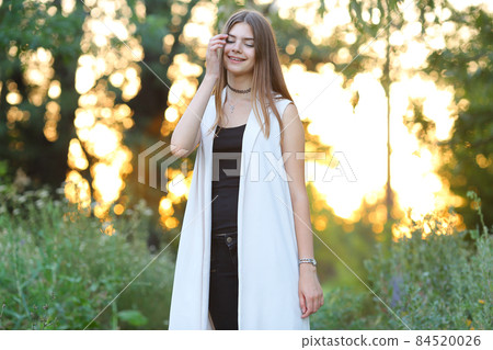 young girl on nature shows emotions 84520026