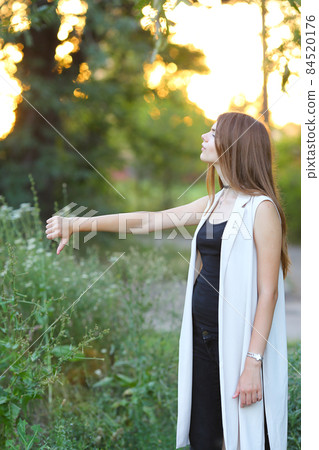 young girl on nature shows emotions young girl on nature shows emotions 84520176