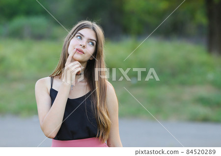 Young beautiful girl shows emotions delight pleasure bliss Young beautiful girl shows emotions delight pleasure bliss 84520289