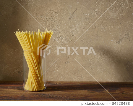 spaghetti pasta on brown wooden shelf spaghetti pasta on brown wooden shelf 84520488