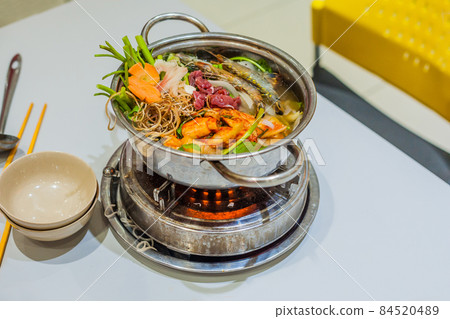Vietnamese soup hot pot with shrimp, pork and sauerkraut Vietnamese soup hot pot with shrimp, pork and sauerkraut 84520489