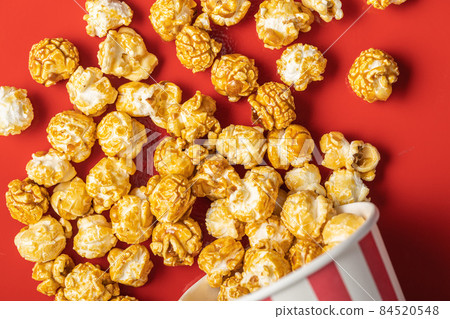 Sweet caramel popcorn in cup. 84520548
