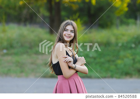 Young beautiful girl shows emotions delight pleasure bliss 84520588