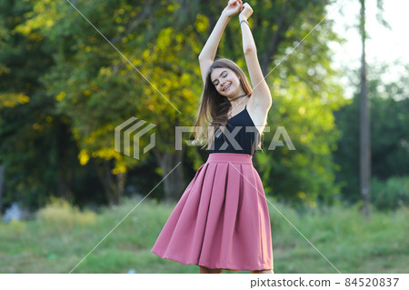 Young beautiful girl shows emotions delight pleasure bliss Young beautiful girl shows emotions delight pleasure bliss 84520837