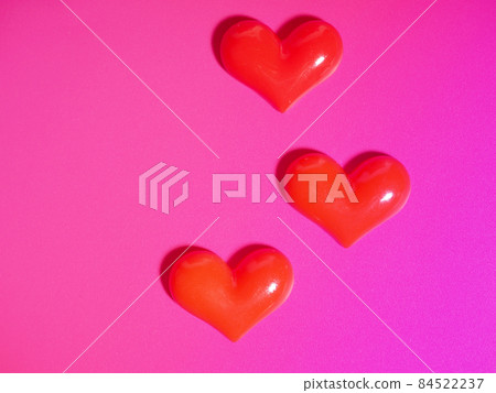 Valentine's Day concept, silver and red heart on pink background, greeting card Valentine's Day concept, silver and red heart on pink background, greeting card 84522237