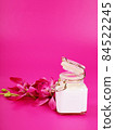 cream jar on pink background with space for text, beauty and health theme, valentine's day gift 84522245