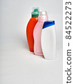 a row of home cleaning bottles on a white background, a place for design 84522273