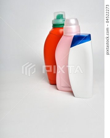a row of home cleaning bottles on a white background, a place for design a row of home cleaning bottles on a white background, a place for design 84522273