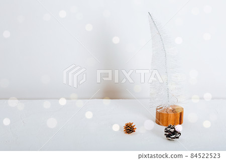 Minimalistic zero west christmas. Eco-friendly Christmas tree on a white minimalistic background. Minimalistic zero west christmas. Eco-friendly Christmas tree on a white minimalistic background. 84522523
