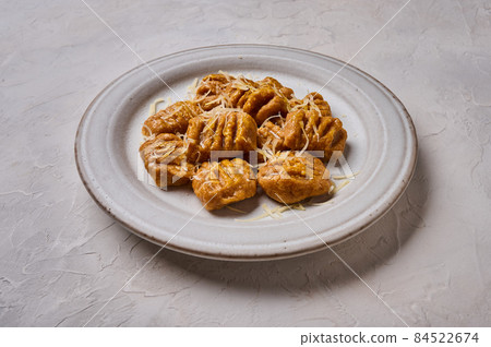 Close up Italian gnocchi from whole grain flour, baked pumpkin puree and parmesan Close up Italian gnocchi from whole grain flour, baked pumpkin puree and parmesan 84522674