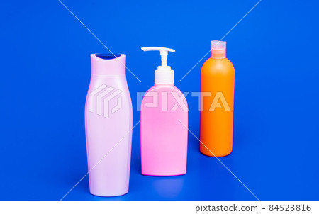 Toiletry and cosmetic plastic containers for liquid shower and bath products packing in row, bottles Toiletry and cosmetic plastic containers for liquid shower and bath products packing in row, bottles 84523816