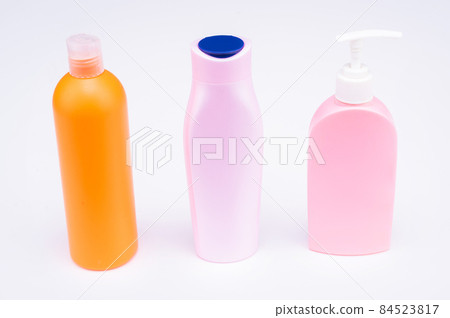 Multicolor refillable flip cap and pump cosmetic product packaging in row, bottles 84523817