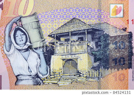 Traditional house from Oltenia and woman from Romanian money 84524131