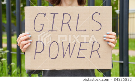 Girl Power concept. Unrecognizable person holds sign with text about feminism 84525853