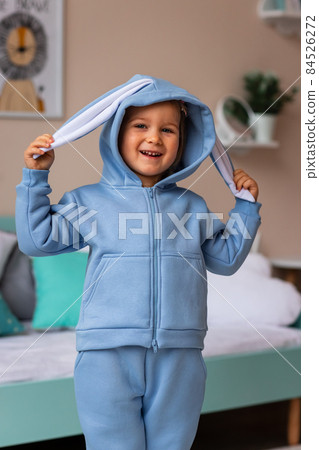 Cute little girl posing in a costume in her room Cute little girl posing in a costume in her room 84526272