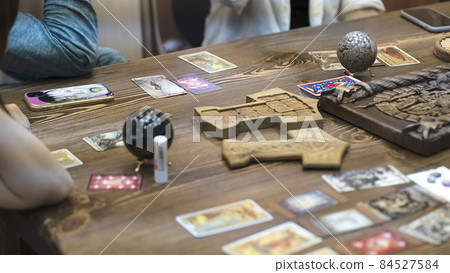 Tarot card reader arranges cards in a card spread. Fortune-telling concept Tarot card reader arranges cards in a card spread. Fortune-telling concept 84527584