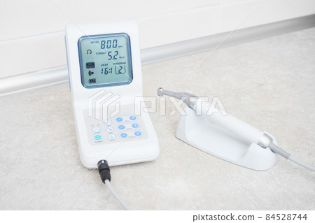dental equipment in the dentist's office for root canal treatment. Close-up, endomotor. 84528744
