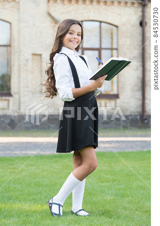 Girl ready for school. Happy girl back to school. Cute little 84530730