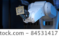 Robotic Arm Holding an Artificial Intelligence Computer Processor Unit 84531417