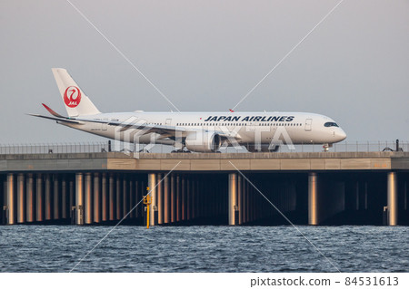 Scenery of Haneda Airport, taxiing passenger plane, Japan Airlines 84531613