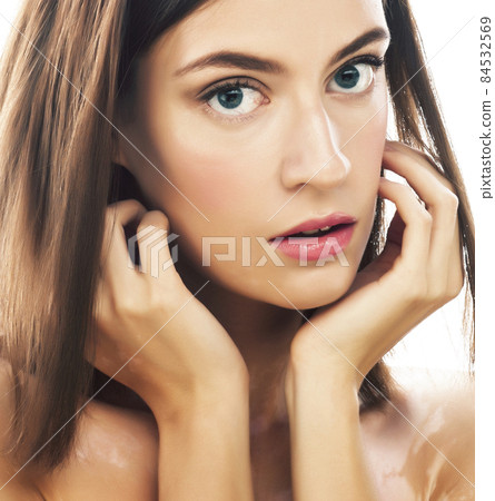 beautiful young brunette woman with vitiligo disease close up isolated on white 84532569