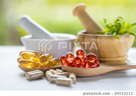 Alternative medicine nature herbal organic capsule, drug with herbs leaf natural supplements for healthy good life. 84533213