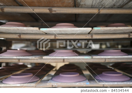 Pottery being dried before firing in the kiln Pottery being dried before firing in the kiln 84534544