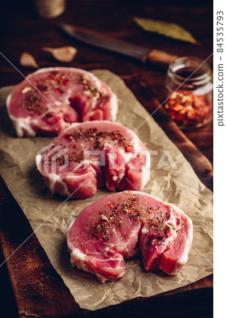 Raw pork loin steaks with different spices Raw pork loin steaks with different spices 84535793