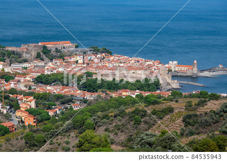 The amazing aerial view over Collioure from Fort Saint Elme surrounded by vineyards, Vermeille coast 84535943